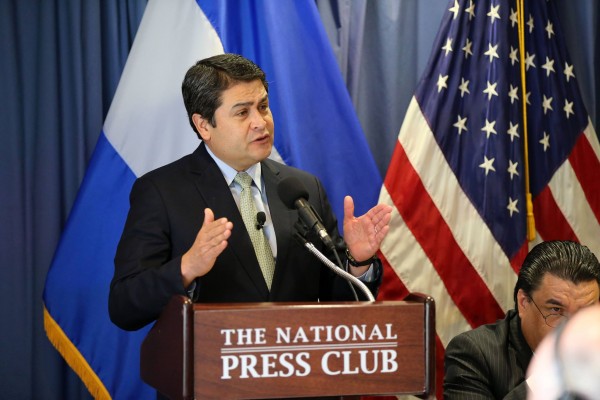 President of Honduras Juan Orlando Hernandez listens to questions from reporters on June 17, 2015 in Washington, DC